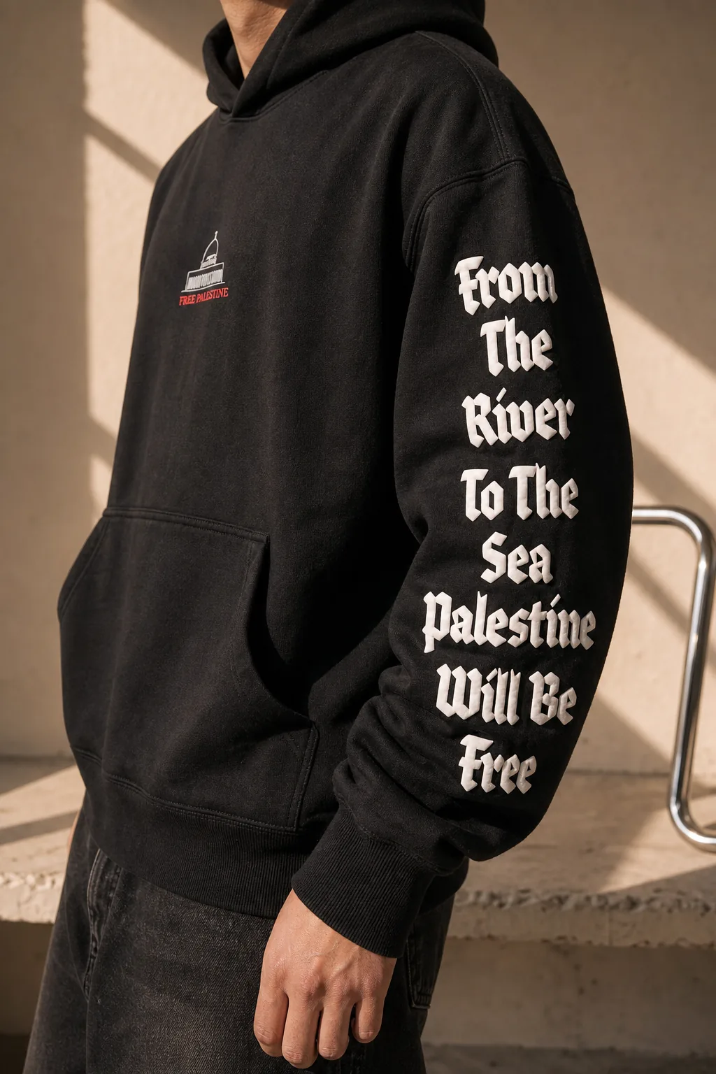 FROM THE RIVER TO THE SEA PALESTINE WILL BE FREE in white gothic type running the length of the sleeve